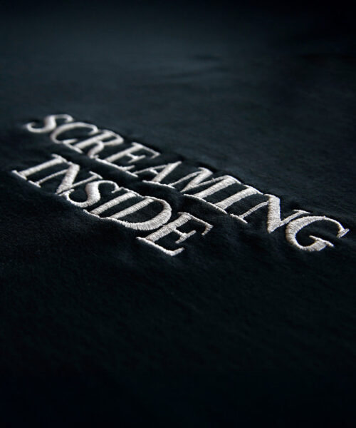Alternative view of screaming-inside-hoodie
